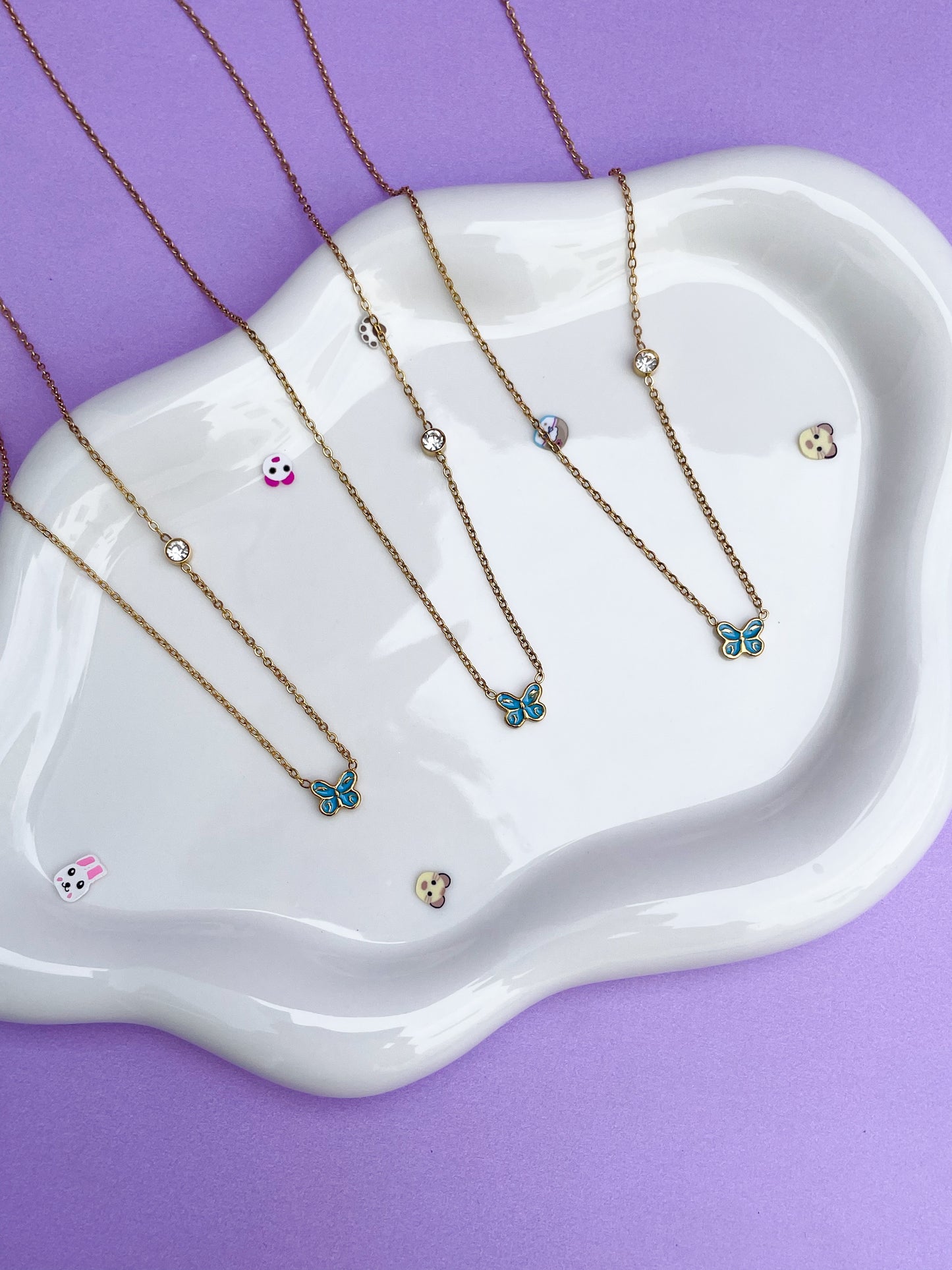 Collar mariposa mini azul con brillantina