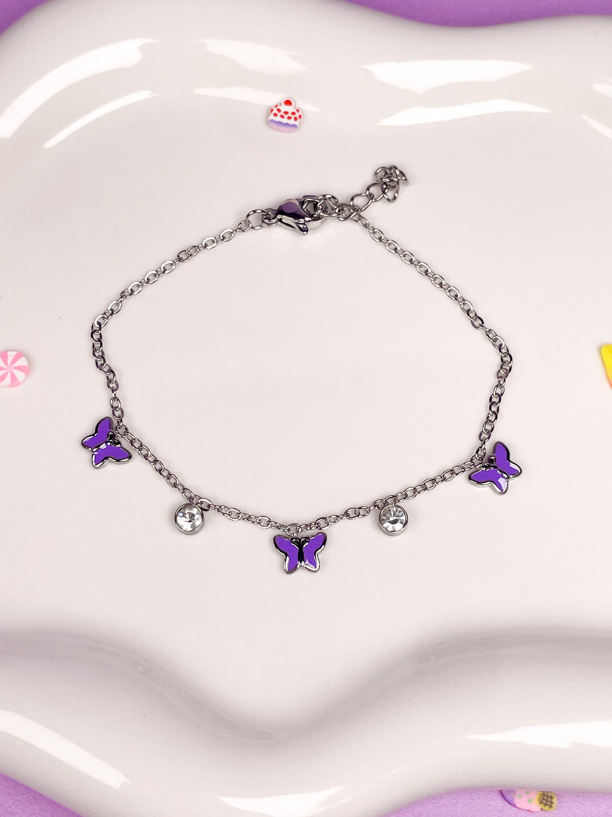 Pulsera plateada mariposas moradas con brillantina