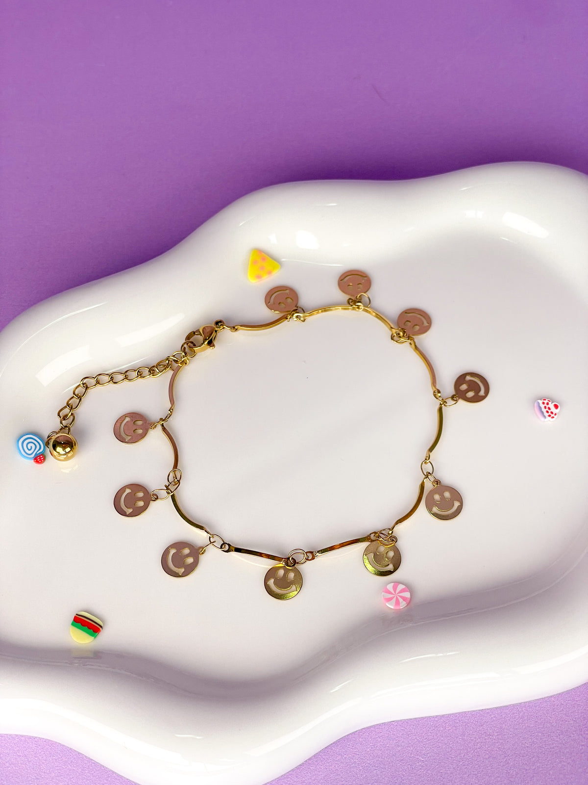 Pulsera dorada de caritas felices