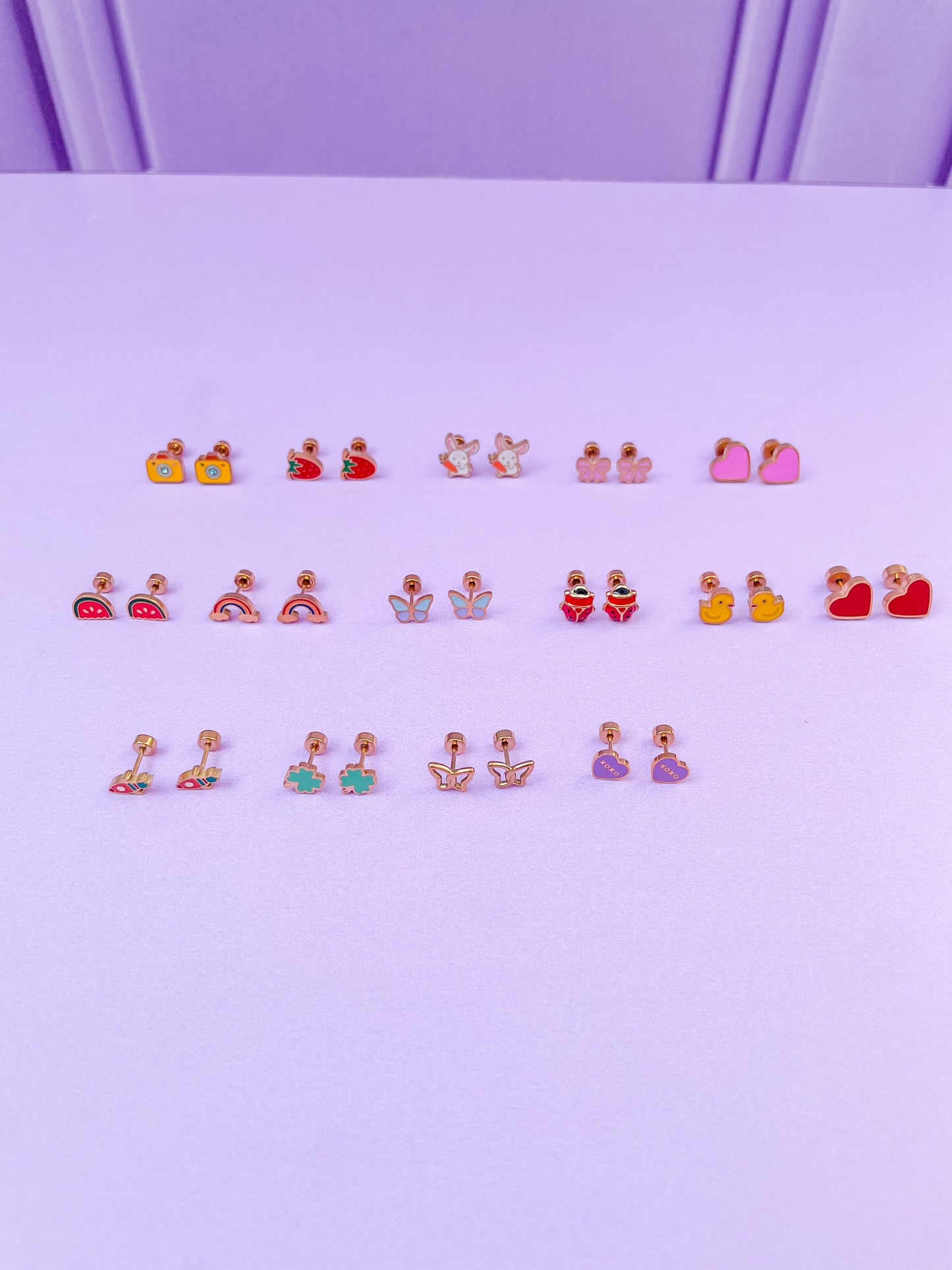Aretes corazón morado xoxo