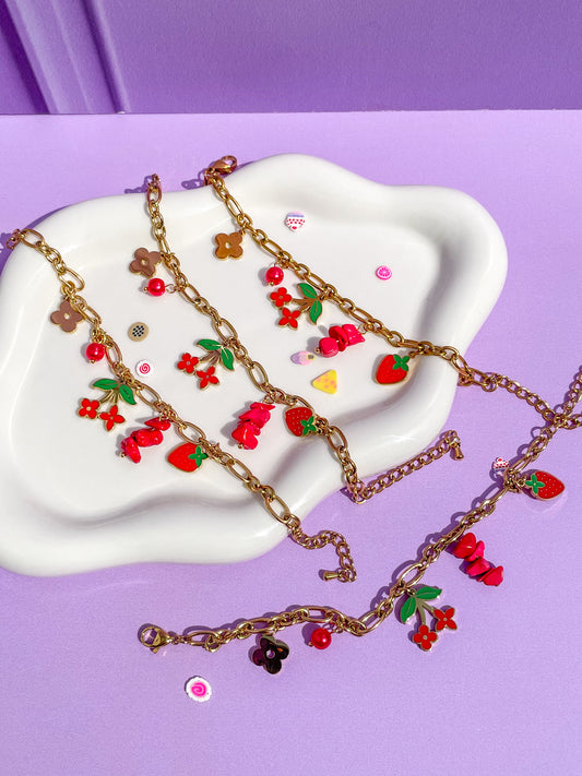 Pulsera charms flores rojas