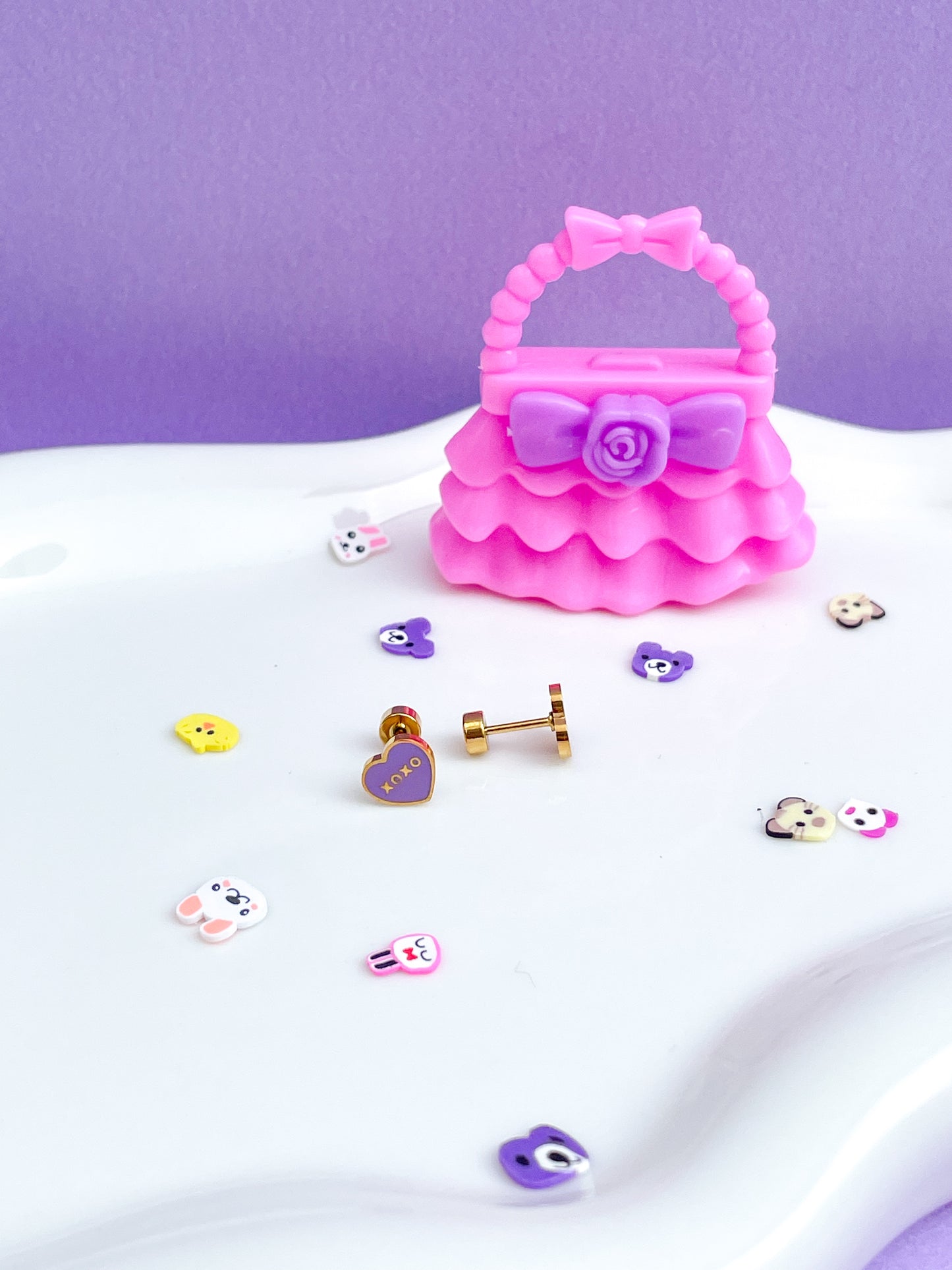 Aretes corazón morado xoxo