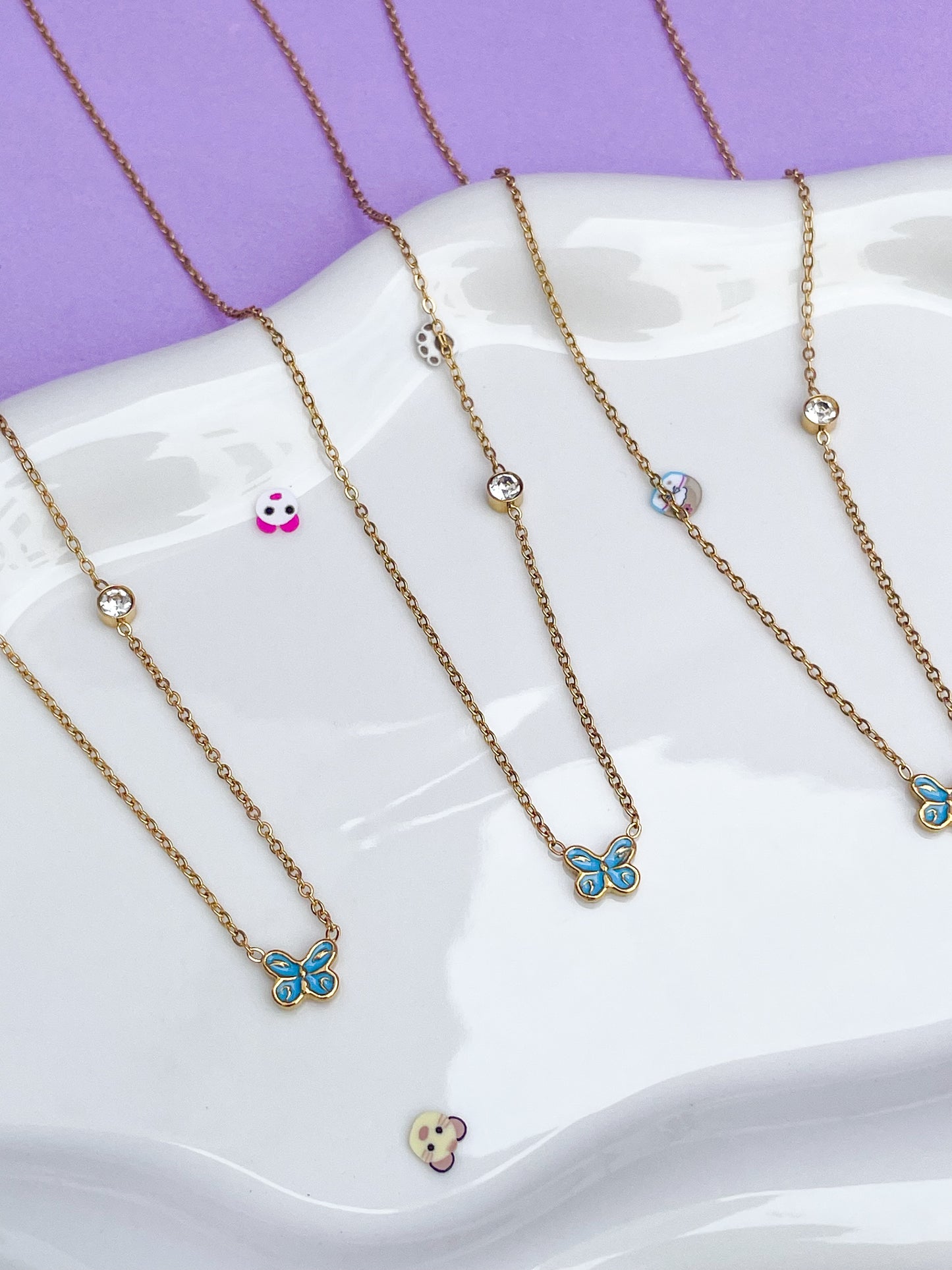 Collar mariposa mini azul con brillantina