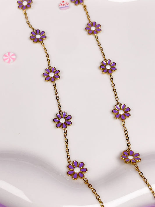 Pulseras dorada de flores moradas