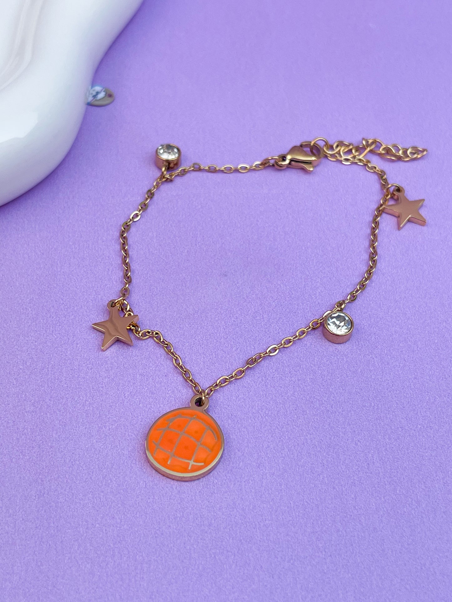 Pulsera concha con estrellas y brillantes