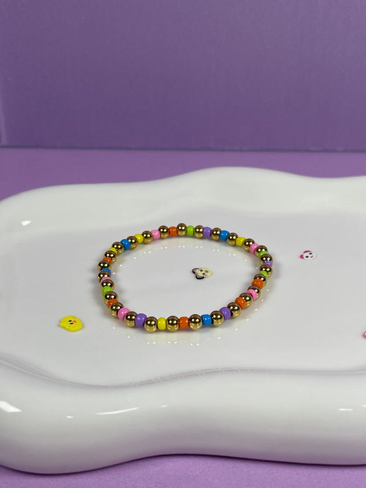 Pulsera elástico bolitas de colores