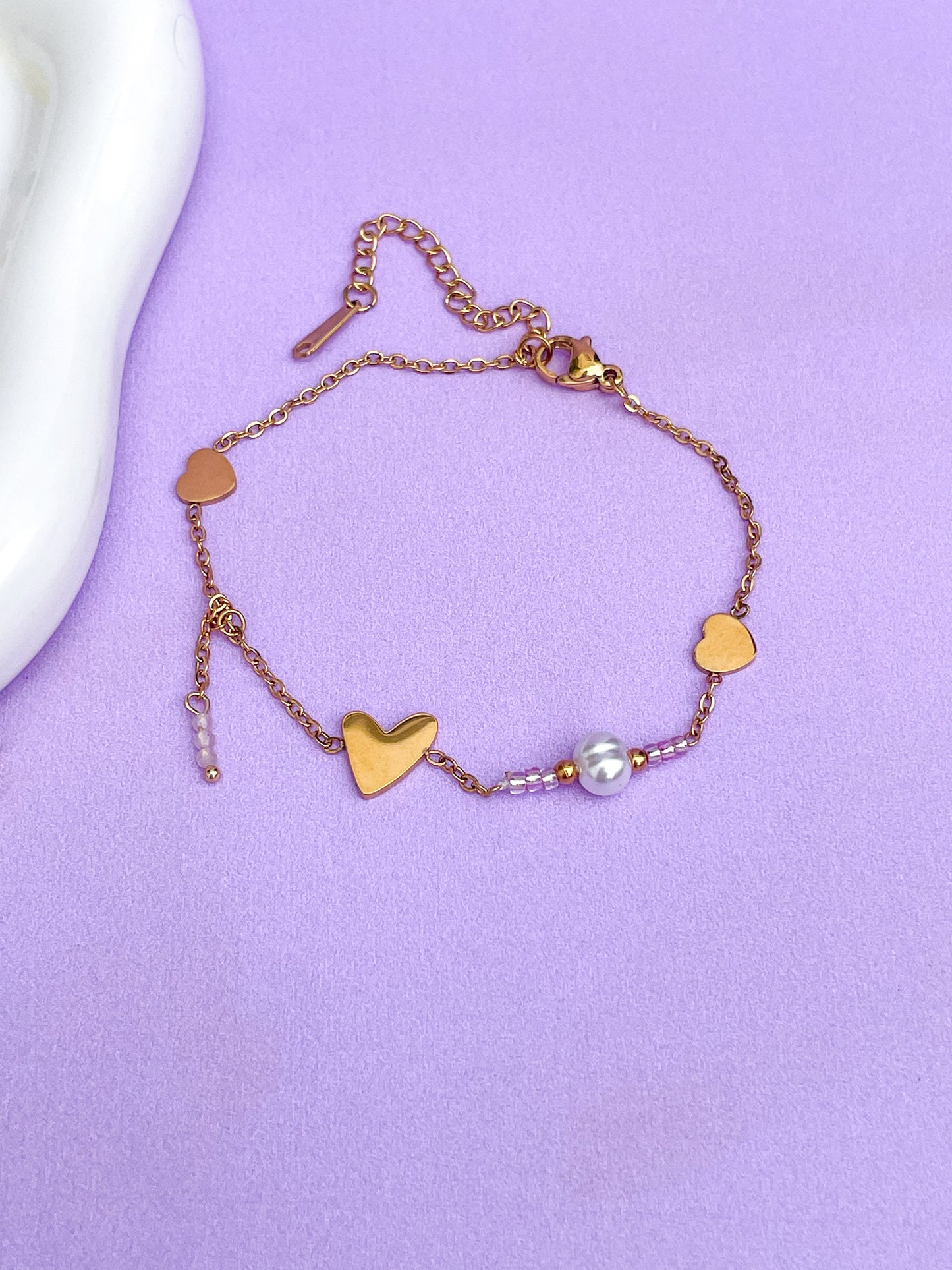 Pulsera corazones dorados