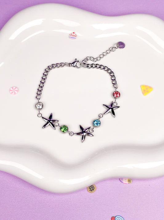 Pulsera plateada estrellas de mar con brillantina