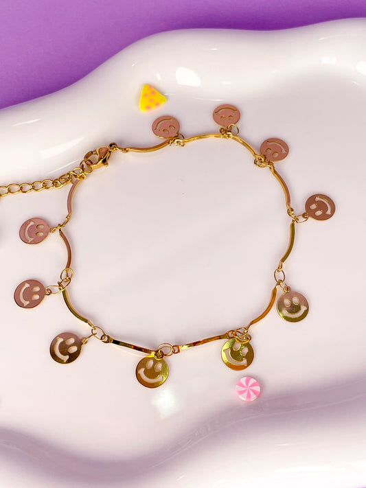 Pulsera dorada de caritas felices